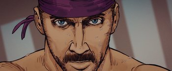 Movie still from “Kick-Ass” (2010), directed by Matthew Vaughn – A man's face with a purple hat on; Extreme Close Up shot, Overhead angle