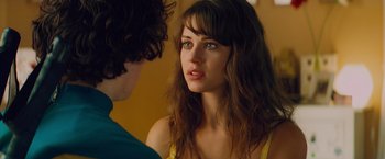 Movie still from “Kick-Ass” (2010), directed by Matthew Vaughn – A young woman looking at a young man in front of a mirror; Close Up shot, Over the shoulder angle