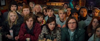 Movie still from “Kick-Ass” (2010), directed by Matthew Vaughn – A group of young people posing for a picture; Medium shot, High angle