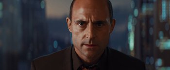 Movie still from “Kick-Ass” (2010), directed by Matthew Vaughn – A person wearing a suit and tie; Close Up shot, Low angle