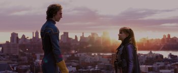 Movie still from “Kick-Ass” (2010), directed by Matthew Vaughn – A man and a woman standing next to each other on top of a hill; Medium shot, Low angle