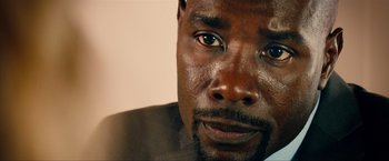 Movie still from “Kick-Ass 2” (2013), directed by Jeff Wadlow – A man's eyes and face; Close Up shot, High angle