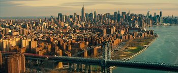 Movie still from “Kick-Ass 2” (2013), directed by Jeff Wadlow – An aerial view of a city with a bridge in the foreground; Extreme Wide shot, High angle