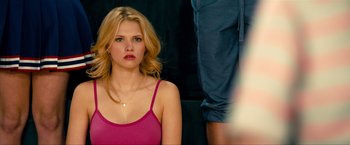 Movie still from “Kick-Ass 2” (2013), directed by Jeff Wadlow – A beautiful young lady sitting in front of a man; Close Up shot, Over the shoulder angle