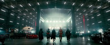Movie still from “Kick-Ass 2” (2013), directed by Jeff Wadlow – A group of people are walking in a building; Wide shot, Low angle