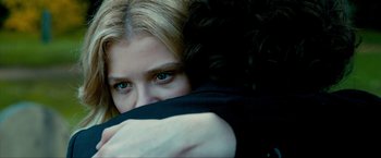 Movie still from “Kick-Ass 2” (2013), directed by Jeff Wadlow – A person with their eyes closed; Close Up shot, Over the shoulder angle