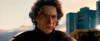 Movie still from “Kick-Ass 2” (2013), directed by Jeff Wadlow – A person wearing a black shirt; Close Up shot, Low angle