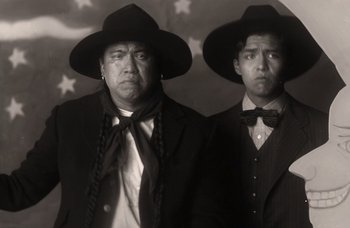 A man and a man in a suit and hat