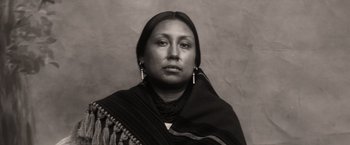 Movie still from “Killers of the Flower Moon” (2023), directed by Martin Scorsese – An old photograph of a native american woman; Close Up shot, Low angle