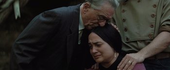 Movie still from “Killers of the Flower Moon” (2023), directed by Martin Scorsese – An older man and a young woman are touching heads; Close Up shot, High angle