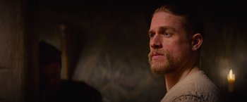 Movie still from “King Arthur: Legend of the Sword” (2017), directed by Guy Ritchie – A person with a beard; Close Up shot, Over the shoulder angle