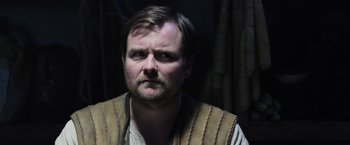 Movie still from “King Arthur: Legend of the Sword” (2017), directed by Guy Ritchie – A person with a beard; Close Up shot, Over the shoulder angle