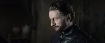 Movie still from “King Arthur: Legend of the Sword” (2017), directed by Guy Ritchie – A person wearing a leather jacket; Close Up shot, Over the shoulder angle