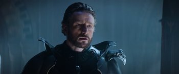 Movie still from “King Arthur: Legend of the Sword” (2017), directed by Guy Ritchie – A person wearing a costume; Close Up shot, Over the shoulder angle