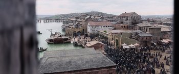 Movie still from “King Arthur: Legend of the Sword” (2017), directed by Guy Ritchie – An image of an old town with a lot of people in it; Extreme Wide shot, High angle