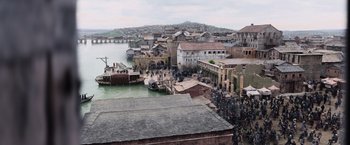 Movie still from “King Arthur: Legend of the Sword” (2017), directed by Guy Ritchie – An image of an old town with a lot of people in it; Extreme Wide shot, High angle