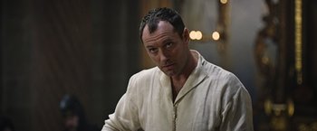 Movie still from “King Arthur: Legend of the Sword” (2017), directed by Guy Ritchie – A person wearing a white shirt; Close Up shot, Over the shoulder angle