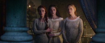 Movie still from “King Arthur: Legend of the Sword” (2017), directed by Guy Ritchie – A group of three women standing next to each other; Medium shot, Low angle