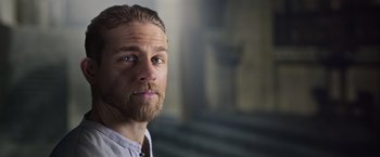 Movie still from “King Arthur: Legend of the Sword” (2017), directed by Guy Ritchie – A person with a beard; Close Up shot, Low angle