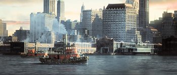 Movie still from “King Kong” (2005), directed by Peter Jackson – A tugboat in the middle of a large city; Extreme Wide shot, High angle