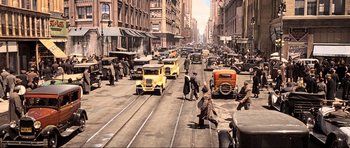 Movie still from “King Kong” (2005), directed by Peter Jackson – An old photo of a busy city street; Extreme Wide shot, High angle