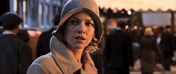 Movie still from “King Kong” (2005), directed by Peter Jackson – A person wearing a hat; Close Up shot, Over the shoulder angle