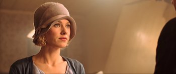 Movie still from “King Kong” (2005), directed by Peter Jackson – A woman wearing a hat and looking to her left; Close Up shot, Low angle