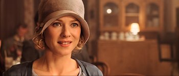Movie still from “King Kong” (2005), directed by Peter Jackson – A woman wearing a hat and looking at the camera; Close Up shot, Over the shoulder angle