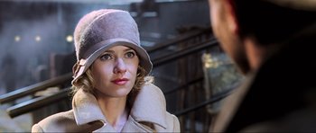 Movie still from “King Kong” (2005), directed by Peter Jackson – A woman wearing a hat looking at a man; Close Up shot, Over the shoulder angle