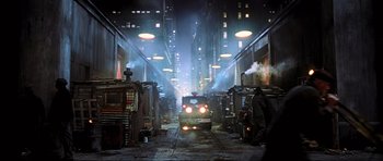 Movie still from “King Kong” (2005), directed by Peter Jackson – A train is traveling down the tracks at night; Extreme Wide shot, Low angle