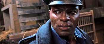 Movie still from “King Kong” (2005), directed by Peter Jackson – A person wearing a hat; Close Up shot, Low angle