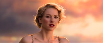Movie still from “King Kong” (2005), directed by Peter Jackson – A beautiful woman with blonde curly hair wearing a gold necklace; Close Up shot, Over the shoulder angle