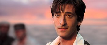 Movie still from “King Kong” (2005), directed by Peter Jackson – A man's face in front of a sunset; Close Up shot, High angle