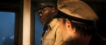 Movie still from “King Kong” (2005), directed by Peter Jackson – A man in a military uniform looking into a mirror; Close Up shot, Over the shoulder angle