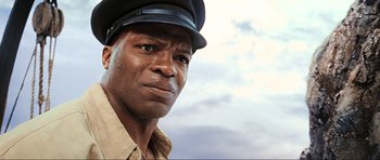 Movie still from “King Kong” (2005), directed by Peter Jackson – A person wearing a hat; Close Up shot, Low angle