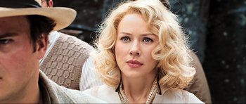 Movie still from “King Kong” (2005), directed by Peter Jackson – A person with blonde hair; Close Up shot, Over the shoulder angle