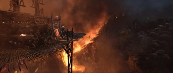 Movie still from “King Kong” (2005), directed by Peter Jackson – A fire is burning in the middle of the night; Extreme Wide shot, High angle