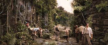 Movie still from “King Kong” (2005), directed by Peter Jackson – A group of men working in the jungle; Wide shot, High angle