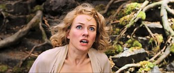 Movie still from “King Kong” (2005), directed by Peter Jackson – A woman with blonde curly hair and blue eyes looking surprised; Close Up shot, Overhead angle