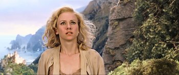 Movie still from “King Kong” (2005), directed by Peter Jackson – A woman standing in front of a cliff with her hair blowing in the wind; Close Up shot, Low angle