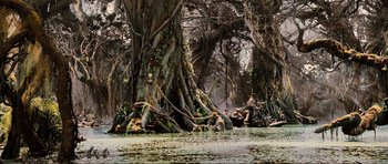 Movie still from “King Kong” (2005), directed by Peter Jackson – A large tree in the middle of a river; Extreme Wide shot, High angle