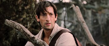 Movie still from “King Kong” (2005), directed by Peter Jackson – A person wearing a shirt and tie; Close Up shot, Over the shoulder angle