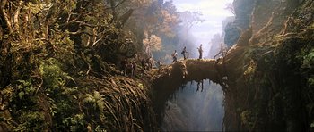 Movie still from “King Kong” (2005), directed by Peter Jackson – A group of people standing on top of a bridge; Extreme Wide shot, High angle