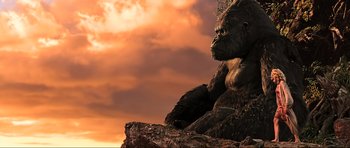Movie still from “King Kong” (2005), directed by Peter Jackson – An image of a gorilla sitting on a rock; Wide shot, Low angle