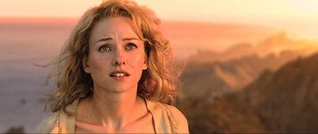 Movie still from “King Kong” (2005), directed by Peter Jackson – A beautiful woman with long blonde curly hair looking to her left; Close Up shot, Over the shoulder angle