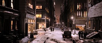 Movie still from “King Kong” (2005), directed by Peter Jackson – People walking down a street at night in the snow; Extreme Wide shot, High angle