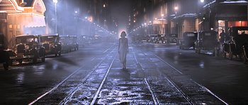 Movie still from “King Kong” (2005), directed by Peter Jackson – A woman walking down the middle of a street at night; Wide shot, Low angle