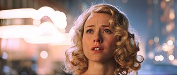 Movie still from “King Kong” (2005), directed by Peter Jackson – A person with curly hair; Close Up shot, Over the shoulder angle