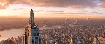 Movie still from “King Kong” (2005), directed by Peter Jackson – An aerial view of a large city at sunset; Extreme Wide shot, High angle