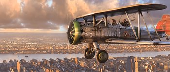 Movie still from “King Kong” (2005), directed by Peter Jackson – An airplane is flying over a city in the sky; Wide shot, Overhead angle